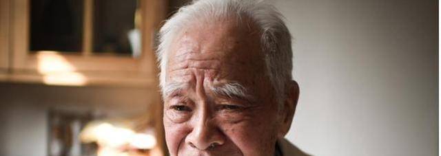 2014年5月的一天,神采飞扬的晏礼根走在穿梭的人群