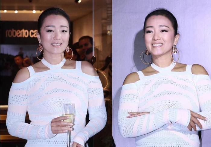 进行 别看巩俐年纪大,但是韵味十足,穿“窟窿眼”上衣还挺显身材的