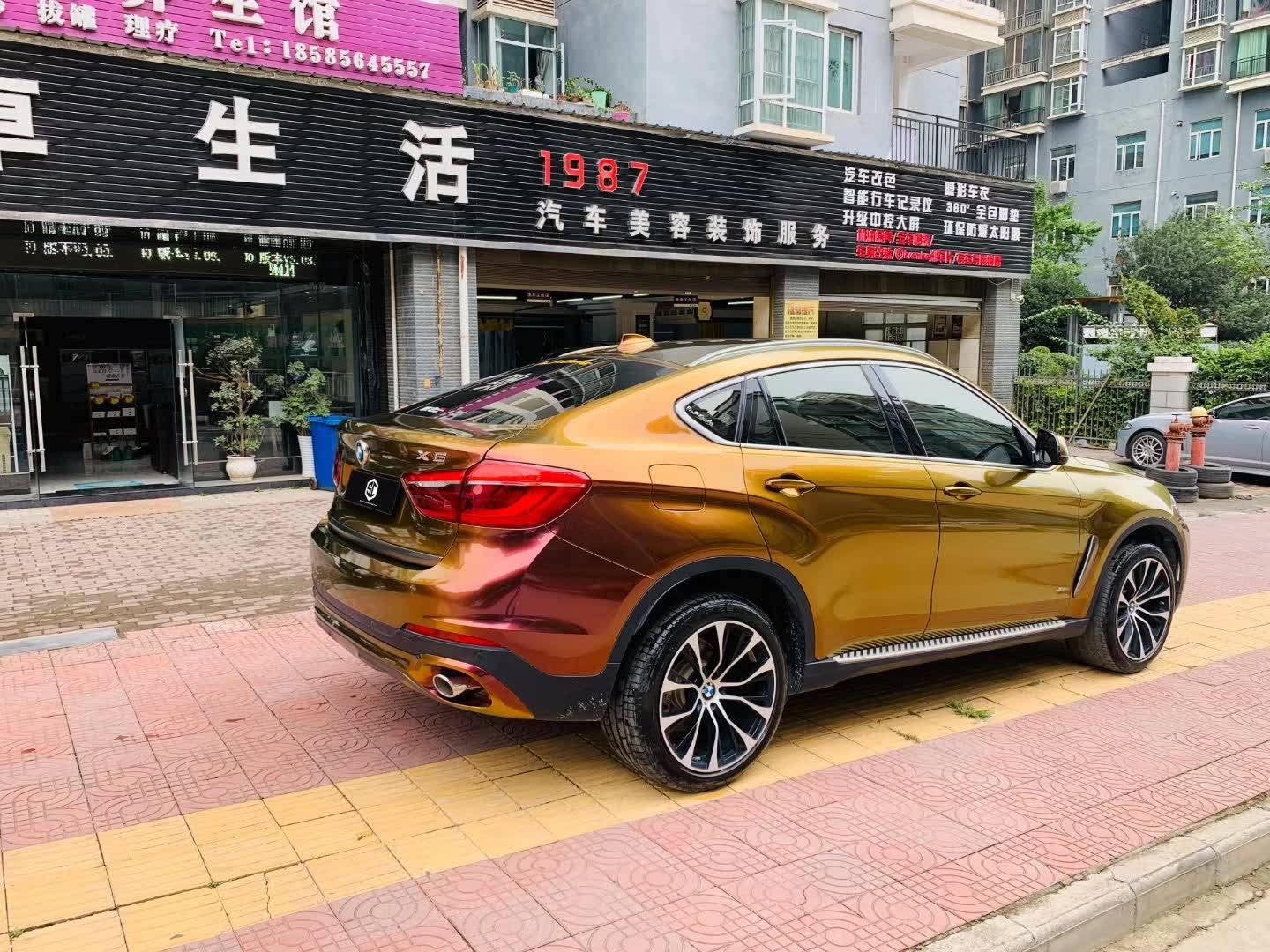 sc改色膜—宝马x6贴膜流光溢彩旭日红_贴膜