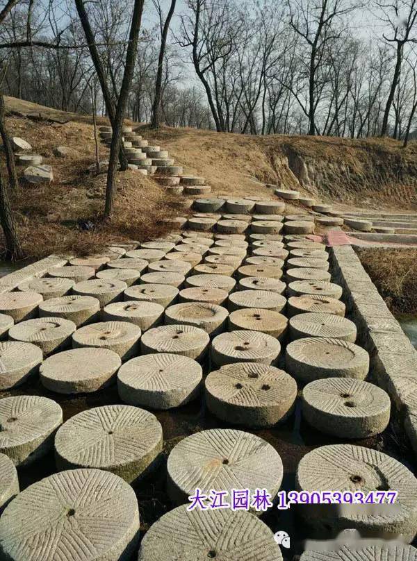 古旧磨盘在园林景观中的应用_石磨