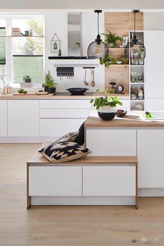 设岛台时直接局部留空做错层,就能腾出卡座区域,上