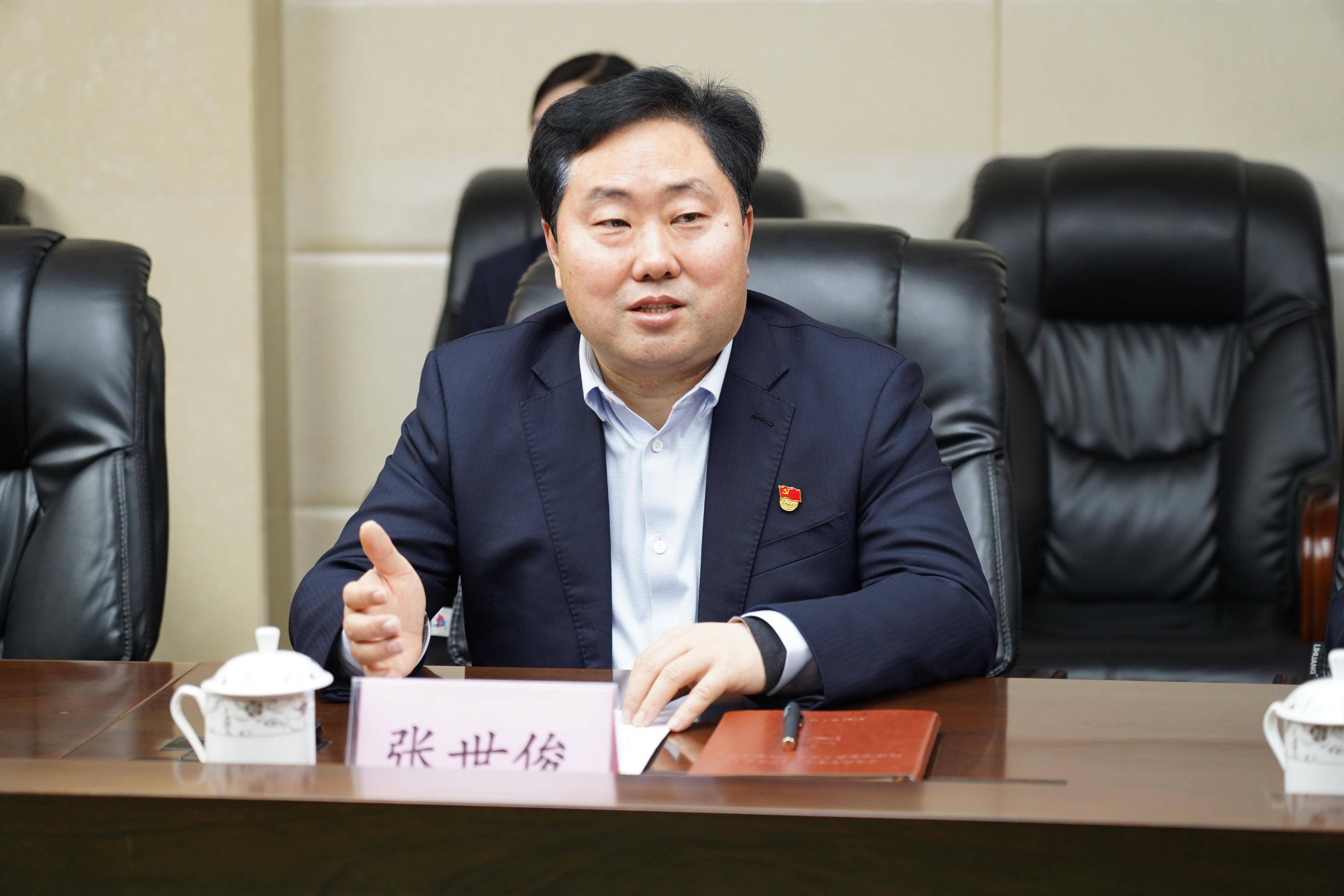 驻马店市邮政分公司党委书记,总经理张世俊和陈克明食品股份有限公司